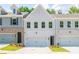 Charming new construction townhome with a two-car garage and manicured front yard at 4537 Moray Dr, Mableton, GA 30126