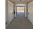 Hallway to the community pool with white pillars, neutral walls, and a glimpse of the inviting pool area at 4537 Moray Dr, Mableton, GA 30126