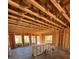 The interior wood framework of a new home, showing exposed beams and window openings at 4537 Moray Dr, Mableton, GA 30126