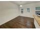 Bright dining room with hardwood floors and a door to the outside at 6077 Oakley Rd, Union City, GA 30291