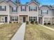 Charming townhome featuring a mix of vinyl siding and brick accents, with a well-manicured lawn and inviting walkways at 6077 Oakley Rd, Union City, GA 30291