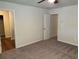 Bedroom featuring neutral carpet, paint, ceiling fan and ensuite bathroom at 7467 Saint David St, Fairburn, GA 30213