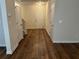 Welcoming foyer with hardwood floors, neutral walls, and ample closet space at 7467 Saint David St, Fairburn, GA 30213