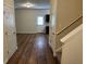 Inviting entryway with hardwood floors and a staircase leading to the upper level at 7467 Saint David St, Fairburn, GA 30213