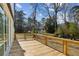 The back porch is constructed of wood and features a metal railing, and a gorgeous view of the property at 1410 Lavista Ne Rd, Atlanta, GA 30324