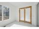 Bright bedroom with a window and wooden sliding doors at 1410 Lavista Ne Rd, Atlanta, GA 30324