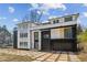 Contemporary home showcasing a modern design with a dark brick garage and geometric concrete driveway at 1410 Lavista Ne Rd, Atlanta, GA 30324