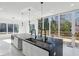 Bright and airy kitchen featuring a large island, modern appliances, and sliding doors to an outdoor deck at 1410 Lavista Ne Rd, Atlanta, GA 30324