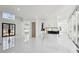 Open-concept living room featuring tile flooring, modern lighting, and an open floorplan into the kitchen at 1410 Lavista Ne Rd, Atlanta, GA 30324