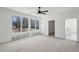 Spacious living room with a contemporary ceiling fan and large picture windows showcasing natural light at 1410 Lavista Ne Rd, Atlanta, GA 30324