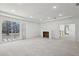 Bright living room with fireplace, recessed lighting, and large sliding glass door to the outdoor view at 1410 Lavista Ne Rd, Atlanta, GA 30324