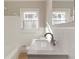 Bright bathroom with a white tile surround and granite countertop at 1796 Arkose Se Dr, Atlanta, GA 30316