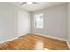 Clean bedroom offers neutral walls, hardwood floors, and a large closet at 1796 Arkose Se Dr, Atlanta, GA 30316