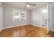 Cozy bedroom with hardwood floors, ceiling fan, and neutral paint at 1796 Arkose Se Dr, Atlanta, GA 30316