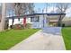 Ranch-style home with a white exterior, red door, and attached carport at 1796 Arkose Se Dr, Atlanta, GA 30316