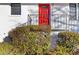 Close up of bright red front door of a white brick home at 1796 Arkose Se Dr, Atlanta, GA 30316