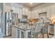 Bright kitchen featuring stainless steel appliances, granite countertops, and a stylish center island with seating at 530 Vandenburg Dr, Villa Rica, GA 30180