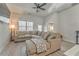 Comfortable living room with modern decor, a large sectional sofa, a ceiling fan, and natural light from a large window at 530 Vandenburg Dr, Villa Rica, GA 30180