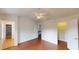 Open-concept bedroom with vaulted ceiling, hardwood floors, and walk-in closet at 65 Devonshire Dr, Alpharetta, GA 30022