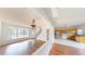 Open layout with wood floors seamlessly connects the living area to the eat-in kitchen at 65 Devonshire Dr, Alpharetta, GA 30022