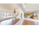 Open layout with wood floors seamlessly connects the living area to the eat-in kitchen at 65 Devonshire Dr, Alpharetta, GA 30022