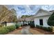 Community pool area featuring a covered pool house and manicured grounds at 65 Devonshire Dr, Alpharetta, GA 30022