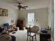 Spacious bedroom with ceiling fan and bright natural light from the large window at 2690 Freemans Walk Dr, Dacula, GA 30019