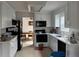 Well-lit kitchen featuring clean white cabinetry and appliances at 2690 Freemans Walk Dr, Dacula, GA 30019