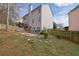 Back exterior view of a house featuring a patio, deck and ample yard space at 4002 Forest Grove Nw Pass, Acworth, GA 30101