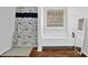 Bright bathroom featuring a shower-tub combo with decorative curtain and a window with blinds at 4002 Forest Grove Nw Pass, Acworth, GA 30101