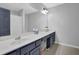 Bathroom featuring double sinks, large vanity, modern fixtures, and a neutral color palette, creating a clean and inviting space at 4002 Forest Grove Nw Pass, Acworth, GA 30101