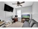 Bedroom setup with a large screen, computer desk, aquarium, and gray couch at 4002 Forest Grove Nw Pass, Acworth, GA 30101