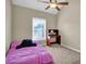 Cozy bedroom featuring a bright window, desk and a plush pink bed, ideal for study and rest at 4002 Forest Grove Nw Pass, Acworth, GA 30101
