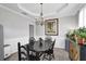 Bright dining room featuring elegant chandelier lighting, stylish decor, and large windows enhancing the space at 4002 Forest Grove Nw Pass, Acworth, GA 30101