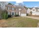 Charming two-story brick home featuring a two-car garage and manicured lawn at 4002 Forest Grove Nw Pass, Acworth, GA 30101
