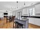 Eat-in kitchen with granite countertops adjoins the spacious living room at 4002 Forest Grove Nw Pass, Acworth, GA 30101