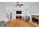 Bright living room with fireplace, hardwood floors, and ample seating at 4002 Forest Grove Nw Pass, Acworth, GA 30101