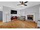 Bright living room with fireplace, hardwood floors, and ample seating at 4002 Forest Grove Nw Pass, Acworth, GA 30101
