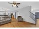 Open-concept living room with hardwood floors and staircase at 4002 Forest Grove Nw Pass, Acworth, GA 30101