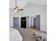 Spacious main bedroom with vaulted ceilings, ceiling fan, and ensuite bathroom entrance, creating a peaceful retreat at 4002 Forest Grove Nw Pass, Acworth, GA 30101