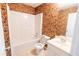 Bathroom features a tub, toilet and vanity with a sink, stylish wallpaper at 480 Glenns Farm Way, Grayson, GA 30017