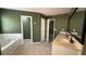Bathroom featuring a soaking tub, double vanity and tile flooring at 480 Glenns Farm Way, Grayson, GA 30017