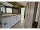 Bathroom featuring a double vanity with white cabinets and tiled flooring at 480 Glenns Farm Way, Grayson, GA 30017