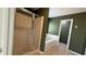 Bathroom featuring a soaking tub, glass shower and dark green walls at 480 Glenns Farm Way, Grayson, GA 30017