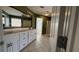 Bathroom featuring double vanity with tiled floors and granite countertops at 480 Glenns Farm Way, Grayson, GA 30017