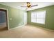 Inviting bedroom with natural light, carpet, and ceiling fan at 480 Glenns Farm Way, Grayson, GA 30017