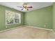 Bedroom with ceiling fan and a large window at 480 Glenns Farm Way, Grayson, GA 30017