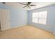 Bedroom with ceiling fan and natural light at 480 Glenns Farm Way, Grayson, GA 30017