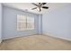 Bedroom with a ceiling fan and window at 480 Glenns Farm Way, Grayson, GA 30017
