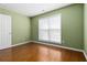Bedroom with hardwood floors and natural light from window at 480 Glenns Farm Way, Grayson, GA 30017